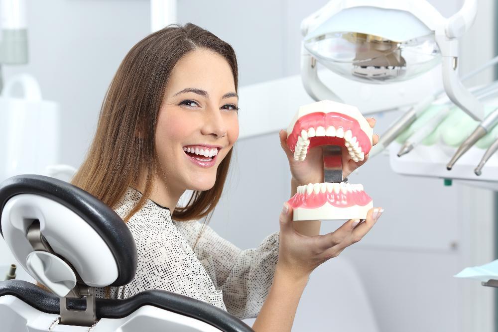 woman smiling sitting in the dental chair