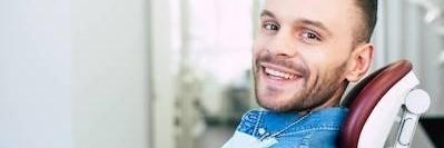 man smiling in dental chair