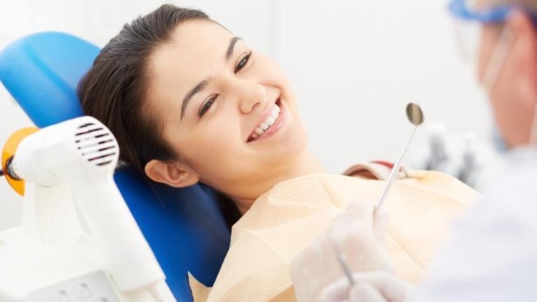 woman in dental chair getting work done