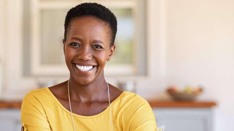 woman smiling after getting teeth whitened