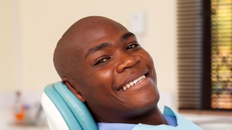 man smiling in dental chair