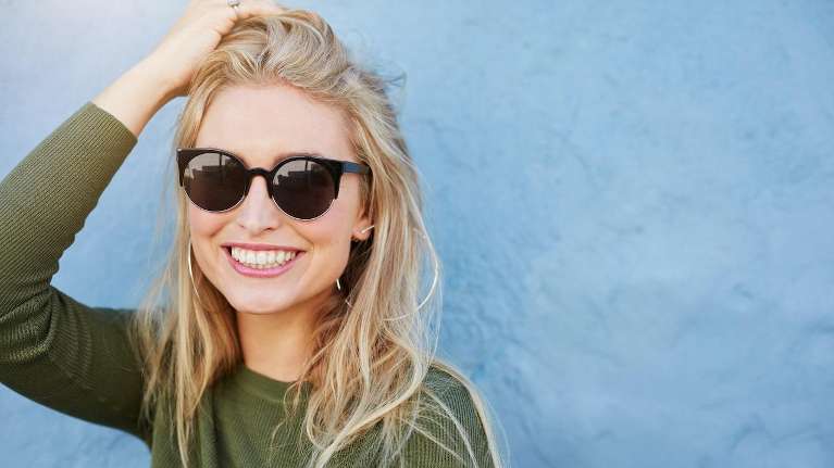 blonde woman smiling | tooth extraction arlington wa