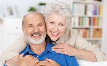 older man and woman smiling