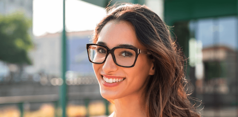 woman wearing glasses smiling | general dentistry arlington wa