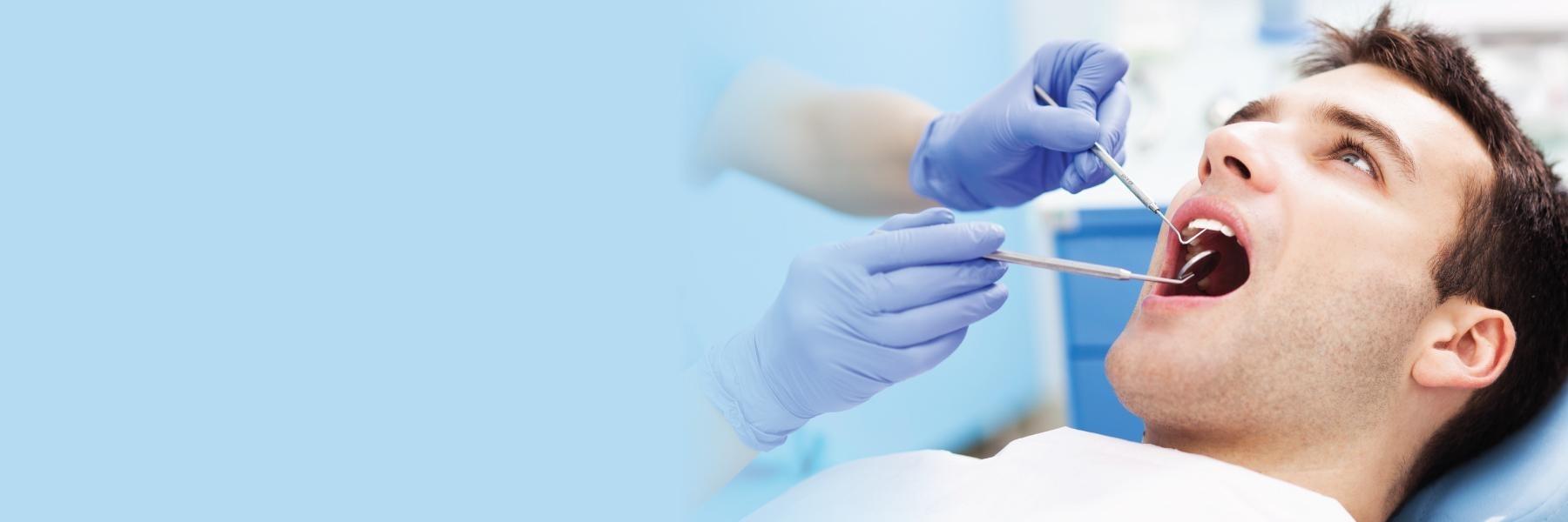 Patient getting exam at dental office in Smokey Point
